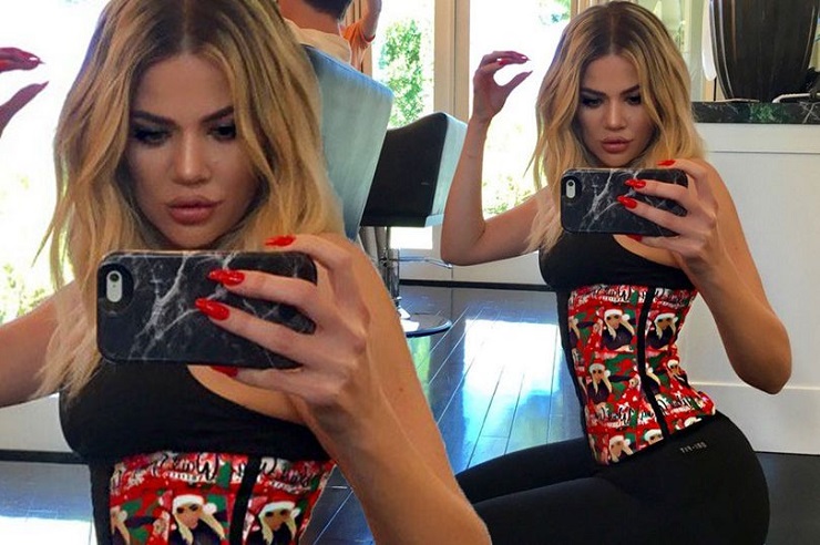 Khloe Kardashian shows off her Extreme curves and slender figure as she snaps festive waist-training selfie