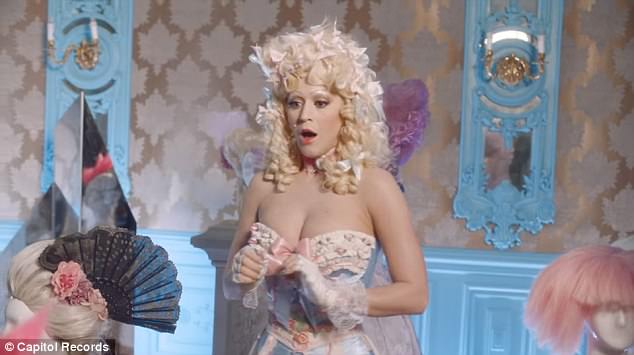 Ooh la la! Busty Katy Perry shows off her cleavage in a Marie Antoinette-inspired corset as she wears a chastity belt in fun new Hey Hey Hey video